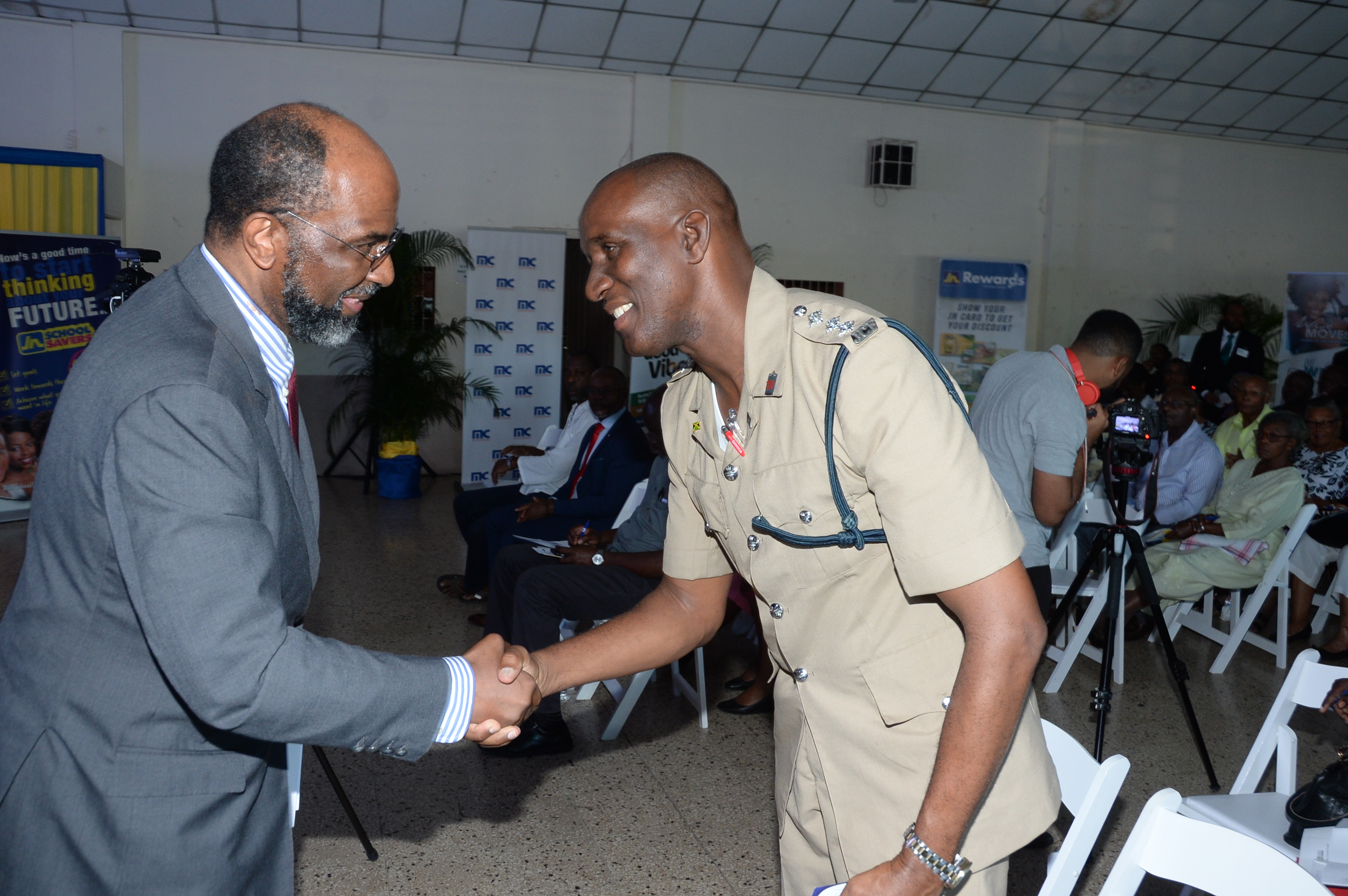 Earl Jarrett (left), Chief Executive Officer, The Jamaica National Group, greets Deputy Superintendent Owen Brown of the May Pen Police Station at The JN Group Community Security Forum, “Creating Safer Spaces for your Family”, held at the St. Gabriel’s Anglican Church Hall, on January 29, 2019. The outreach initiative supports the police in their crime-fighting efforts.