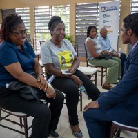 - From left to right, Melrose McLean and Christine Dandy, members of JN Bank Ocho Rios, have a discussion with Ricardo Dystant, Chief, JN Bank Operations & IT at the Ocho Rios leg of the JN Members’ Meeting, held recently at the St. Johns Anglican Church Hall.